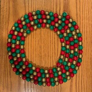 9 FOOT STRAND OF BEADED CHRISTMAS GARLAND, RED/GREEN/GOLD, LIKE NEW.